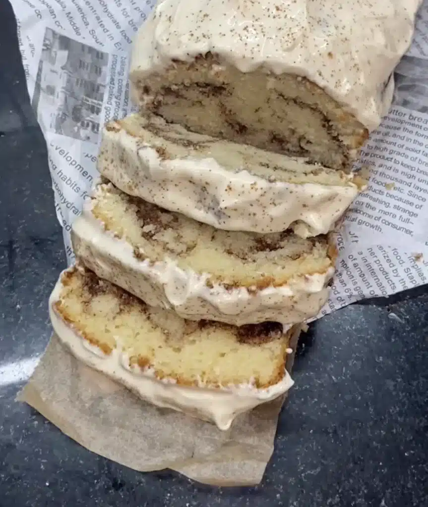 Cinnamon peach loaf sliced with visible swirl