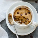 Chocolate chip cookie in a mug with ice cream