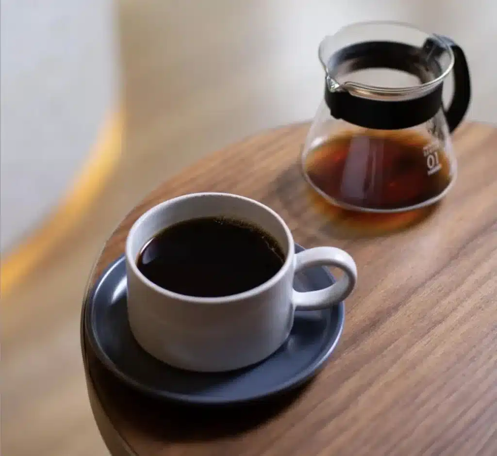 Featured image of a coffee cup with cinnamon and collagen—what is coffee loophole morning ritual