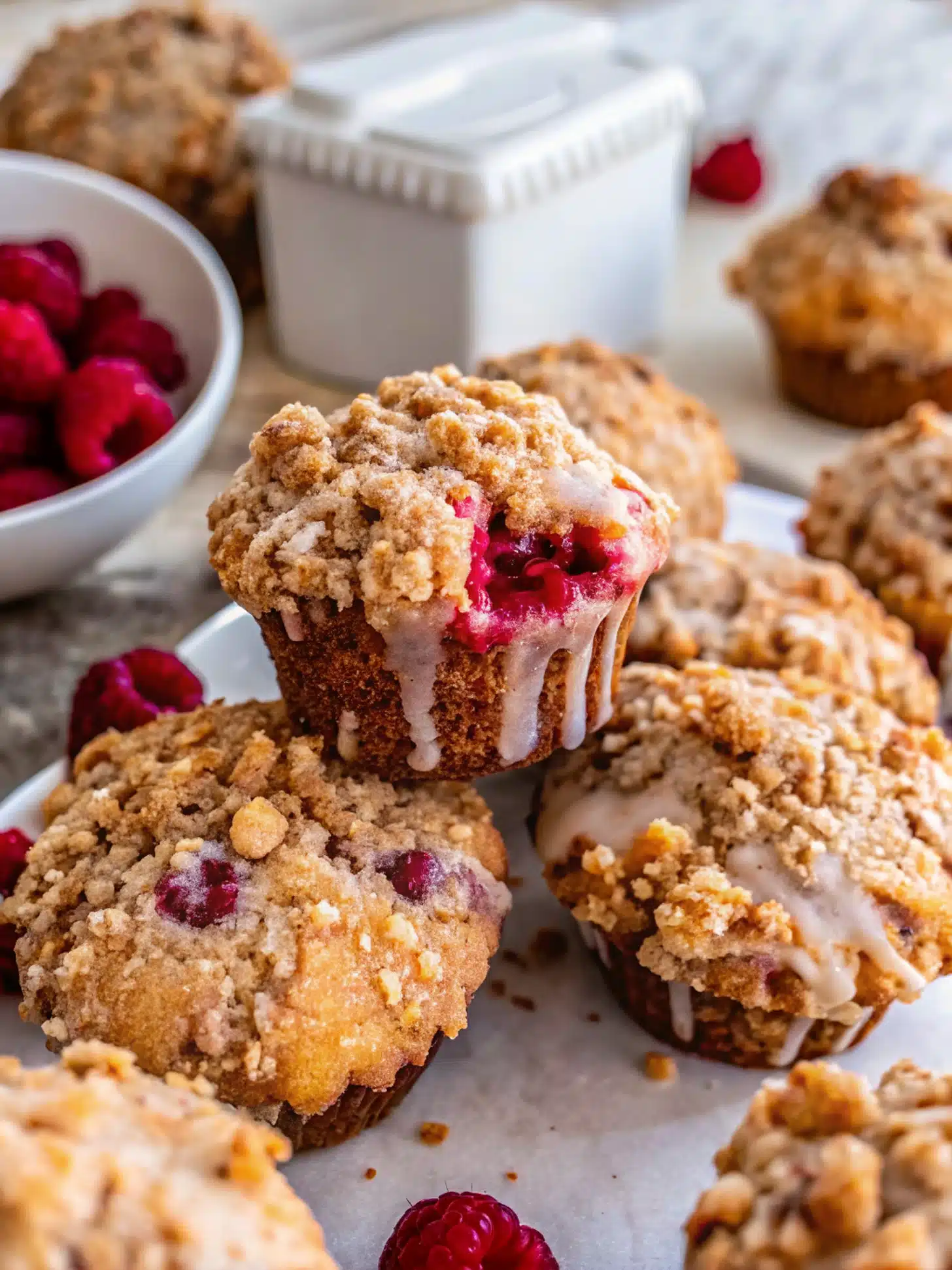 Lemon raspberry muffins with streusel on wooden table